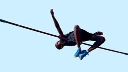 Male athlete doing high jump