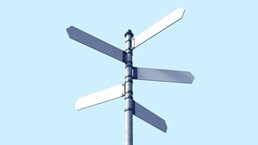 Signpost with three blank signs on sky backgrounds