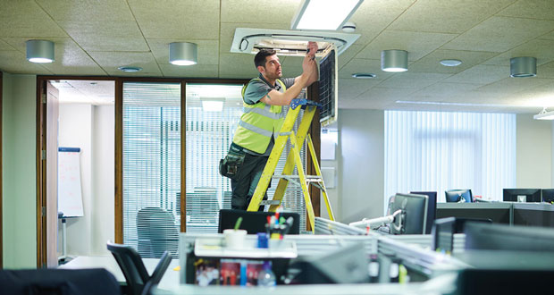 Engineers over equipment