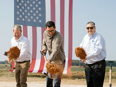Rivian - Rendering Composite image with left panel showing site plan of Rivian’s Stanton Springs North EV plant in Georgia and right panel showing rendering of landscaped creekside boardwalk near the future factory.